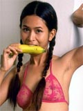 Naughty little asian slut eats banana and open her pussy wide